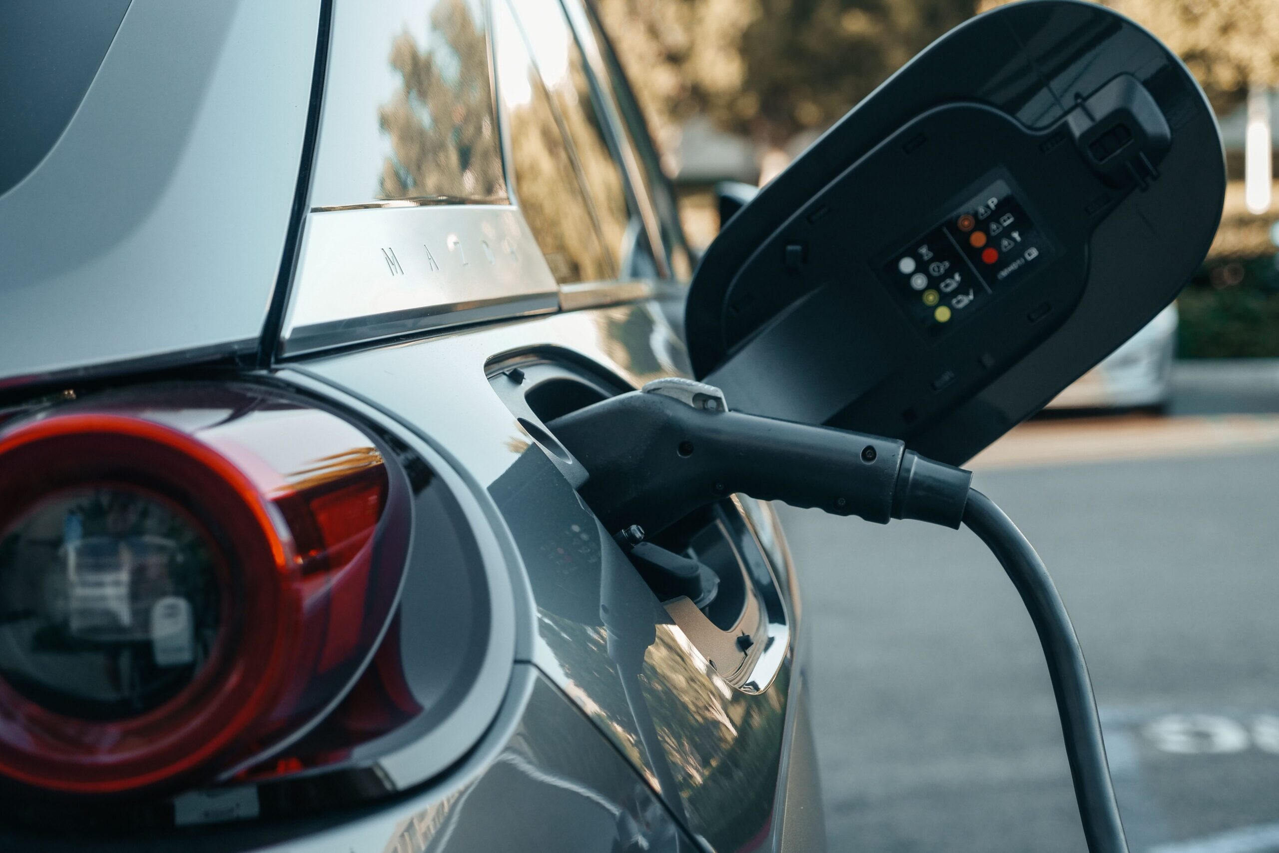 Home Close-up of an electric vehicle being charged, highlighting modern clean energy technology.